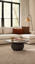 Load image into Gallery viewer, black wood coffee table in living room across from sectional
