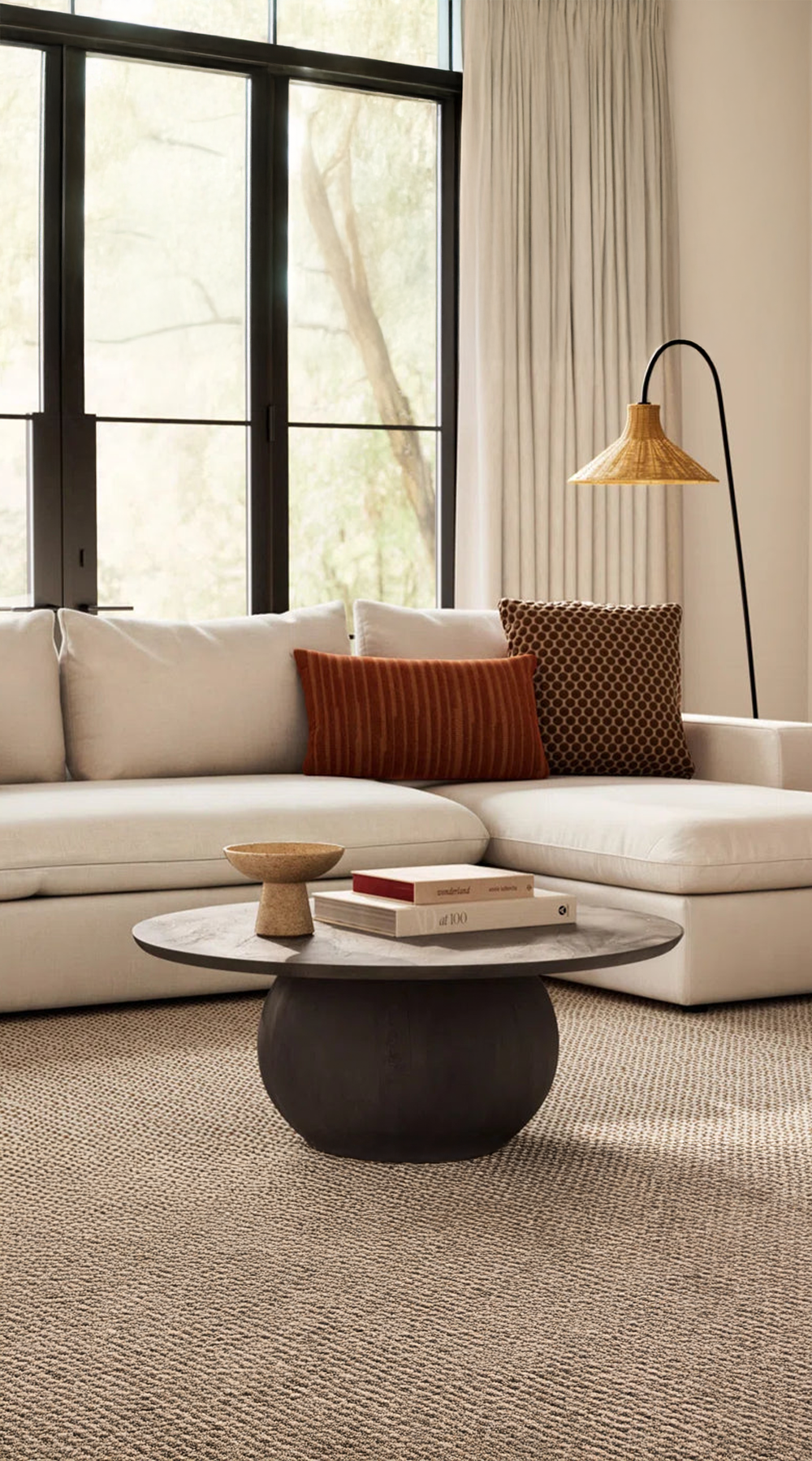 black wood coffee table in living room across from sectional