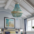 Load image into Gallery viewer, boho beaded chandelier hanging from ceiling in a room
