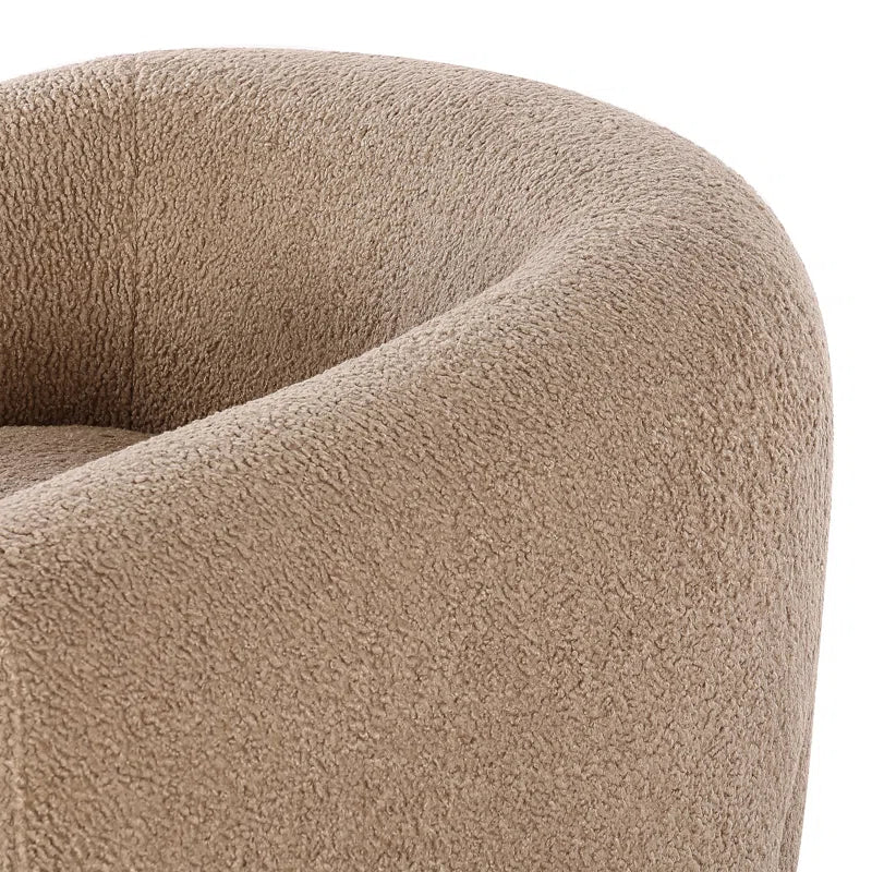 boucle barrel chair close-up with white background