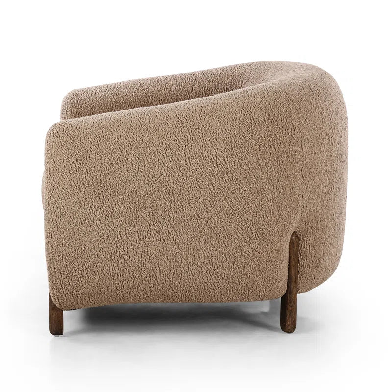 boucle barrel chair side view with white background