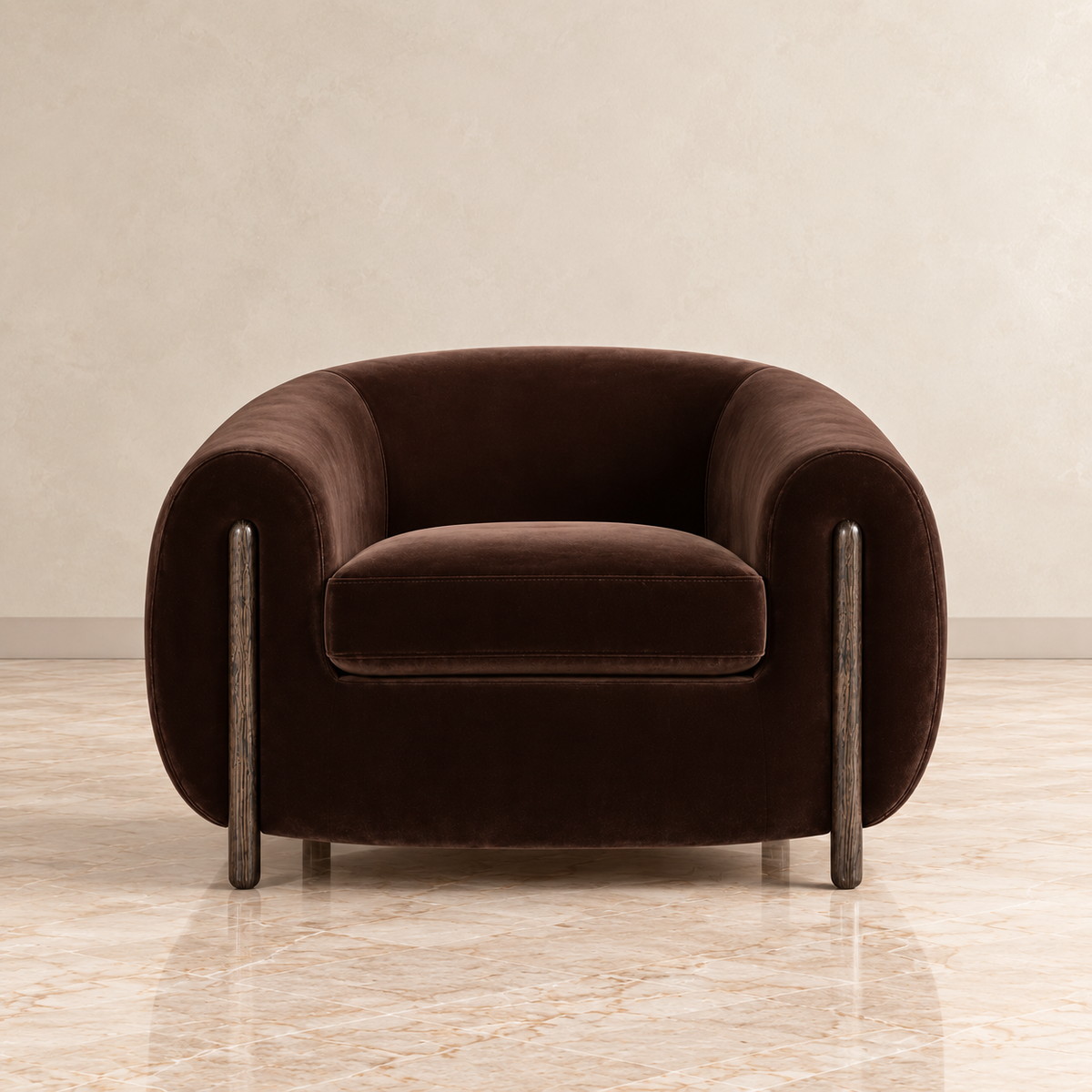 A dark brown velvet barrel chair with a rounded barrel shape and distressed dark metal legs, set against a neutral beige textured wall and marble floor.