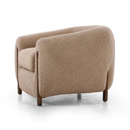 boucle barrel chair side view with white background