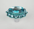 Load image into Gallery viewer, Elegant turquoise crystal cabinet knob with faceted oval center and round accents on polished silver base on white background
