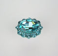 Load image into Gallery viewer, Elegant turquoise crystal cabinet knob with faceted oval center and smaller surrounding crystals on a neutral background
