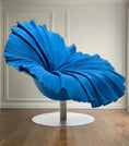 Load image into Gallery viewer, A modern FLOWER CHAIR by House of Effy with a metallic base and an elaborate, flowing blue design resembling a large flower or petal, displayed in a minimalistic office space with white walls and wooden flooring.
