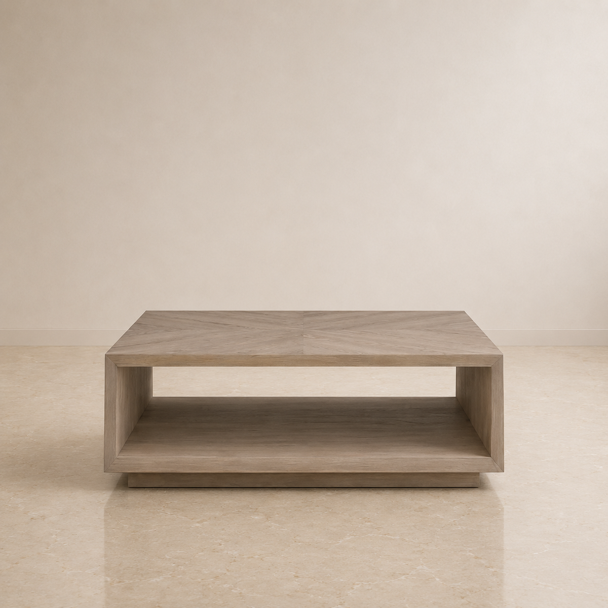 A modern low coffee table with a light gray wood finish and an open lower shelf, set against a minimalist beige wall and floor.