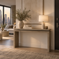 Load image into Gallery viewer, A modern concrete console table in a warm beige tone, styled in a contemporary living room with a ceramic lamp, a large textured vase with branches, and a small bowl on top.

