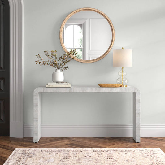 console table on hardwood floor with mirror above it