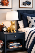 Load image into Gallery viewer, corgi lamp in a room on a table next to a bed and a clock
