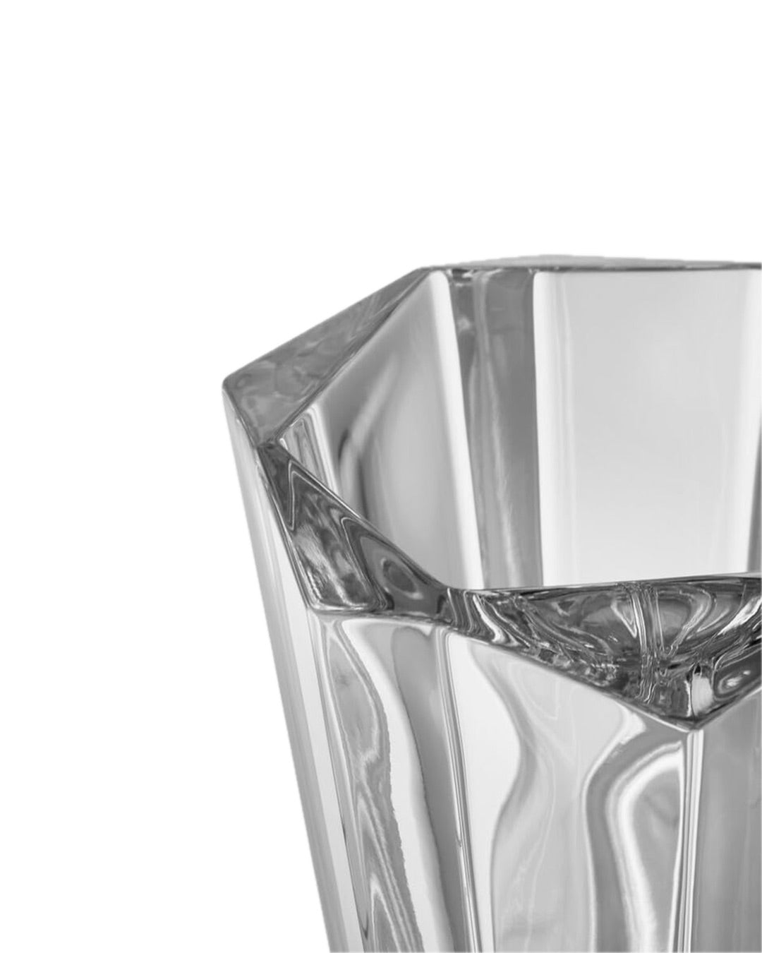 Close-up of clear Fiona Crystal Vase with geometric facets and polished edges on white background