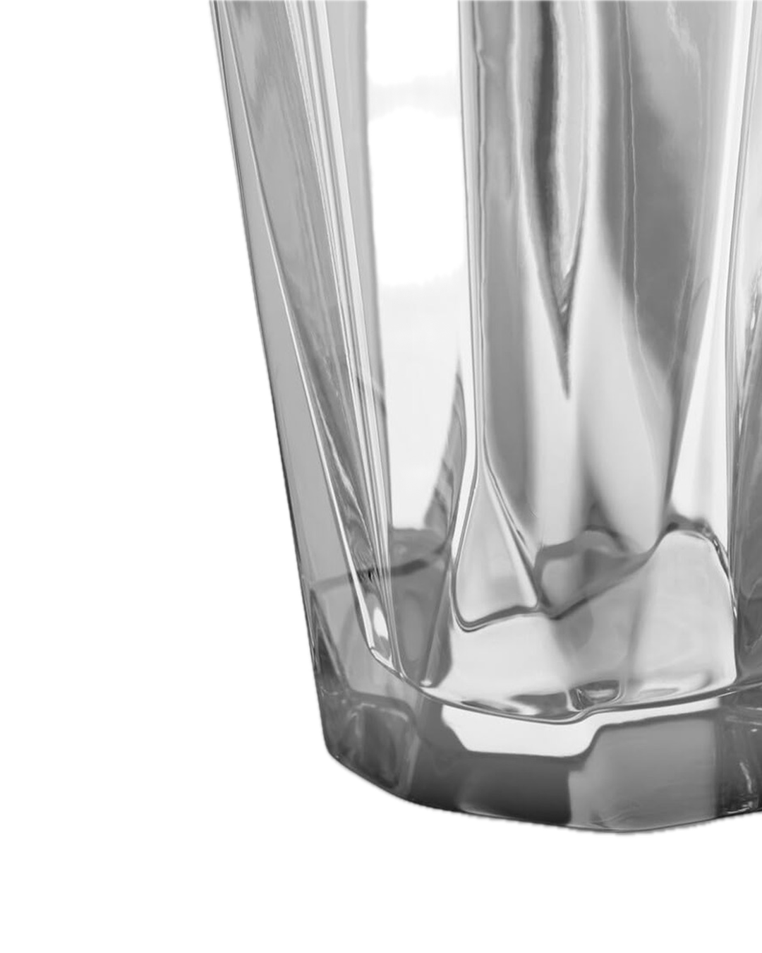 Close-up of clear multifaceted crystal vase with angular geometric design on white background