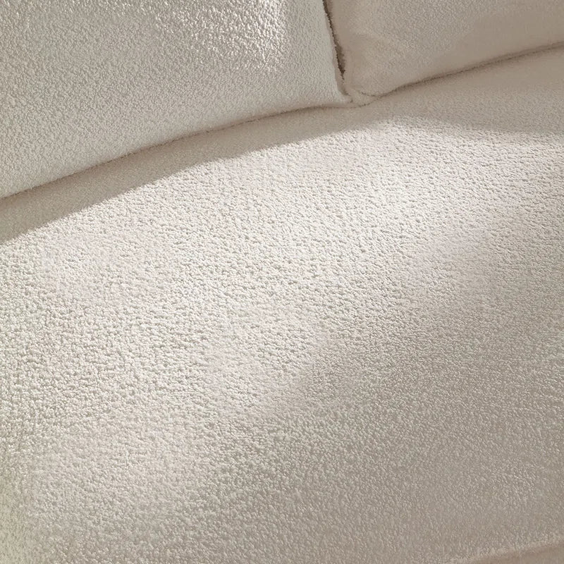 curved sofa boucle fabric close-up