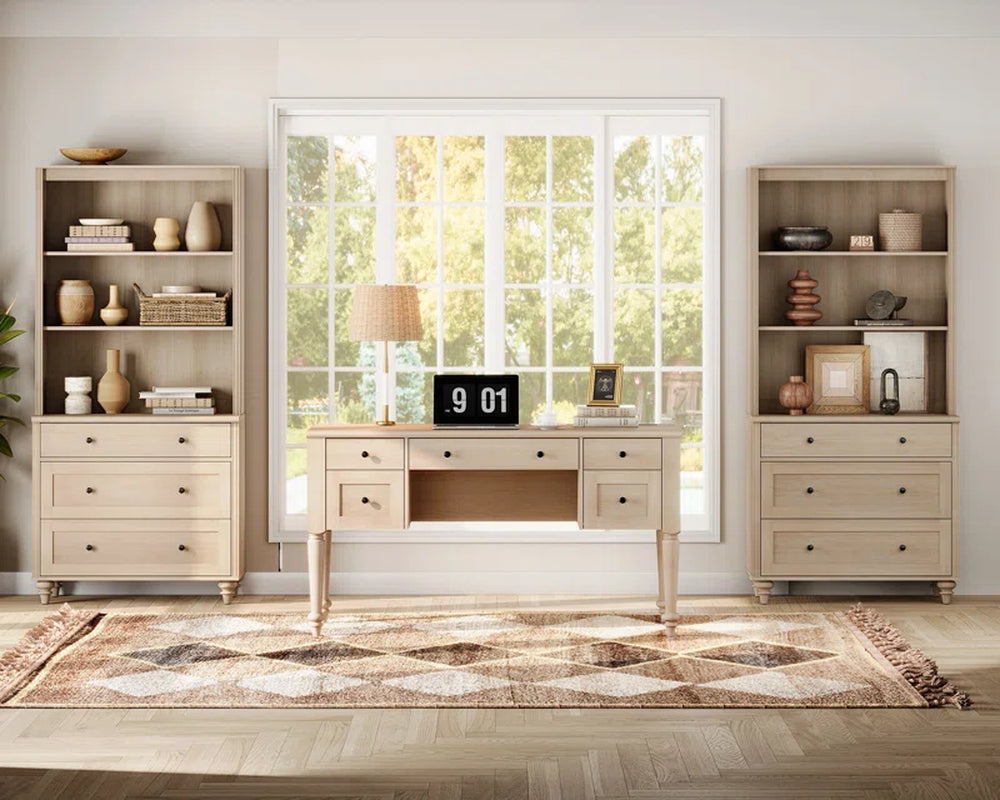 desk with it's parts broken out and the are against the wall and the center piece is on an area rug in front of window facing the window