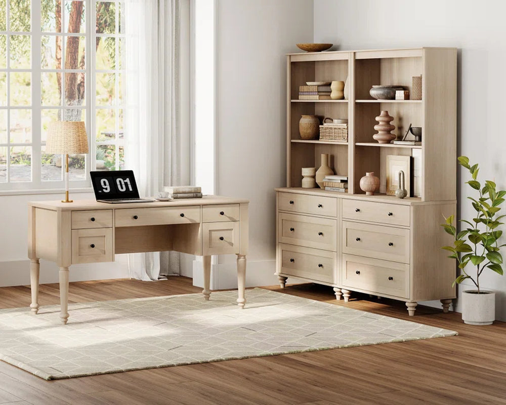 desk in home office space on top of area rug and by the window