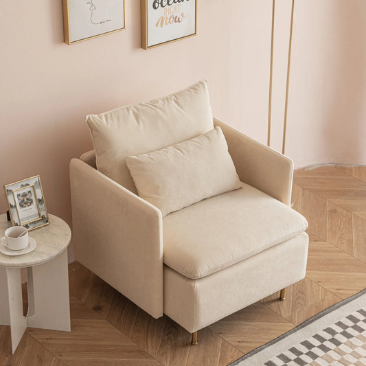 A beige House of Effy MINIMALIST ACCENT CHAIR with a matching cushion, set on a wooden floor next to a small round white side table holding a framed photo and a white coffee cup. The chair's modern design is complemented by wall art hanging in the background, making it the perfect sturdy solid hardwood addition.