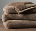 Load image into Gallery viewer, Faux Chinchilla Throw mocha colored folded on table
