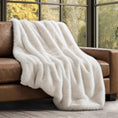 Load image into Gallery viewer, Luxury Faux Fur Throw on a brown leather sofa in the living room next to large windows
