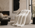 Load image into Gallery viewer, FAUX FUR THROW IVORY in living room on chair across from fireplace and coffee table that has books on it
