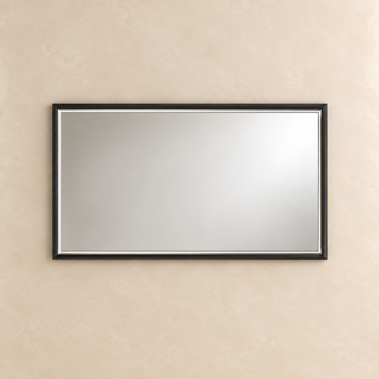 A rectangular wall mirror with a slim black frame and a thin silver inner trim, mounted on a textured beige plaster wall.