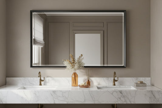 framed mirror in bathroom above sink