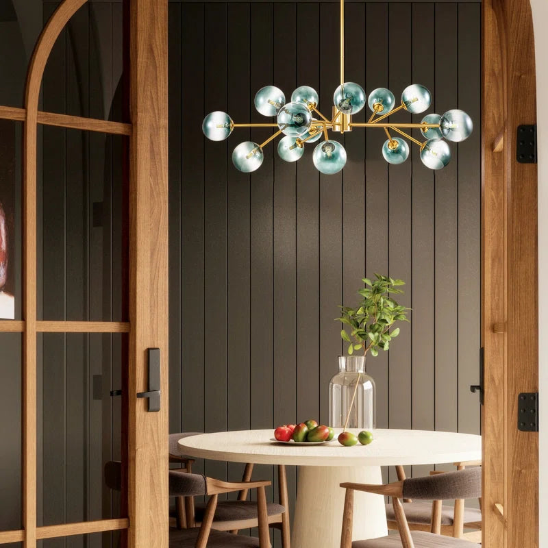 glass globe chandelier in dining room above a round dining table