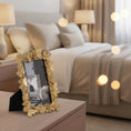 Load image into Gallery viewer, gold picture frame side view in a bedroom on a table
