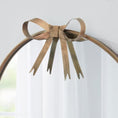 Load image into Gallery viewer, gold round mirror close-up of bow on top
