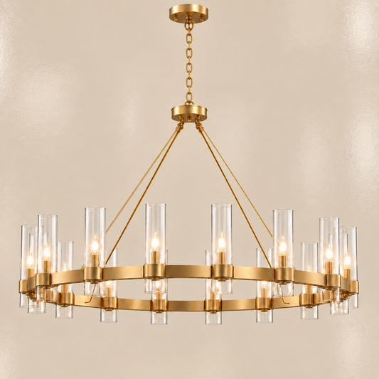 A modern 16-light chandelier with a brushed gold metal ring, clear glass cylindrical shades, and warm glowing bulbs, suspended from a matching gold chain against a neutral beige background.