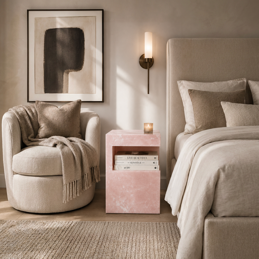 HARPER ONYX STONE TABLE in bedroom next to bed and under a sconce
