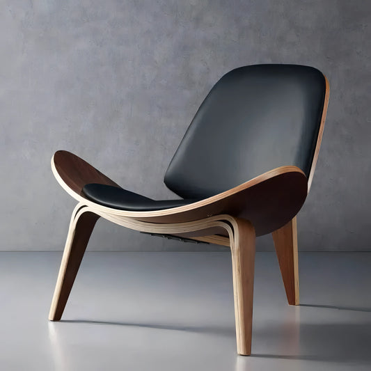 A modern House of Effy Shell Chair with a sleek black seat and curved wooden legs against a textured gray background.