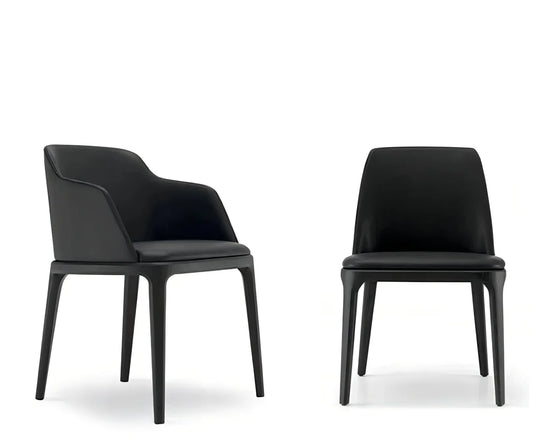 Two modern black House of Effy wooden dining chairs against a white background, one with armrests and one without.