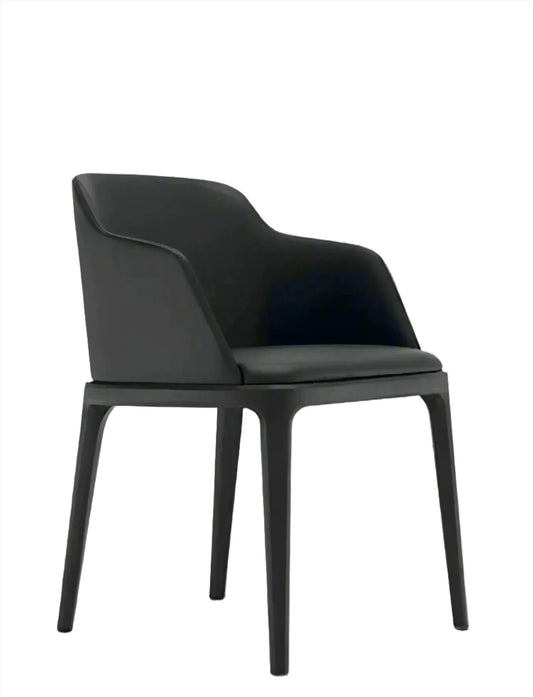 A modern black House of Effy wooden dining chair with a smooth, curved backrest and four sturdy legs, positioned against a gradient gray background.