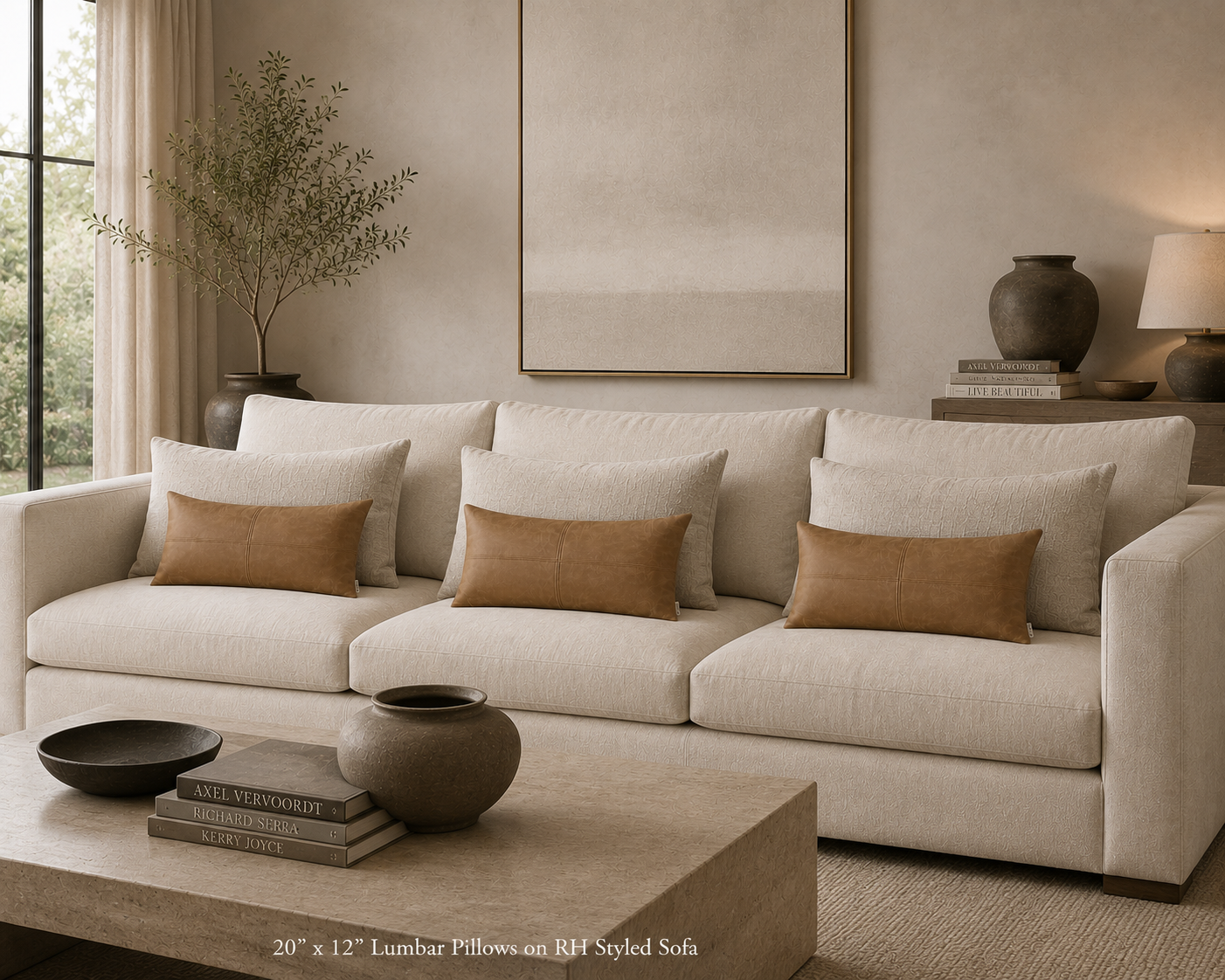 leather pillow in a living room with a large window and a console table in the background with a vase and lamp
