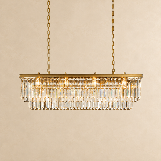 An ornate oval wall mirror with a gold scalloped frame, mounted on a textured beige wall.
