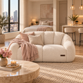 Load image into Gallery viewer, loveseat sofa in a modern, warm-toned living room setting, styled with pink and beige throw pillows and a matching fringed throw blanket.
