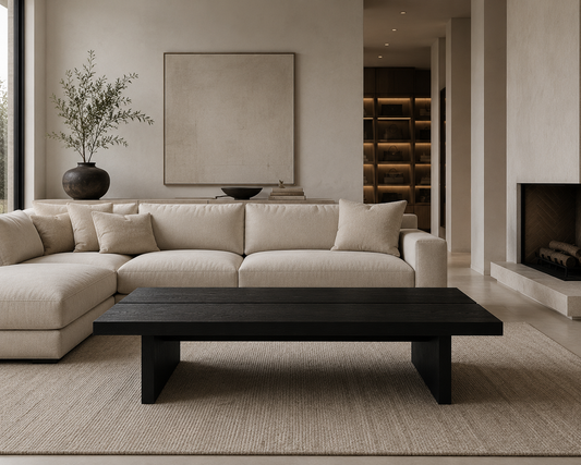 luka coffee table in a living room with sofa, vase, artwork on walls and fireplace