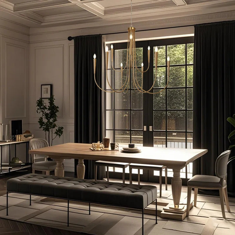 modern gold chandelier in dining room above a dining table with seating and a coffered ceiling