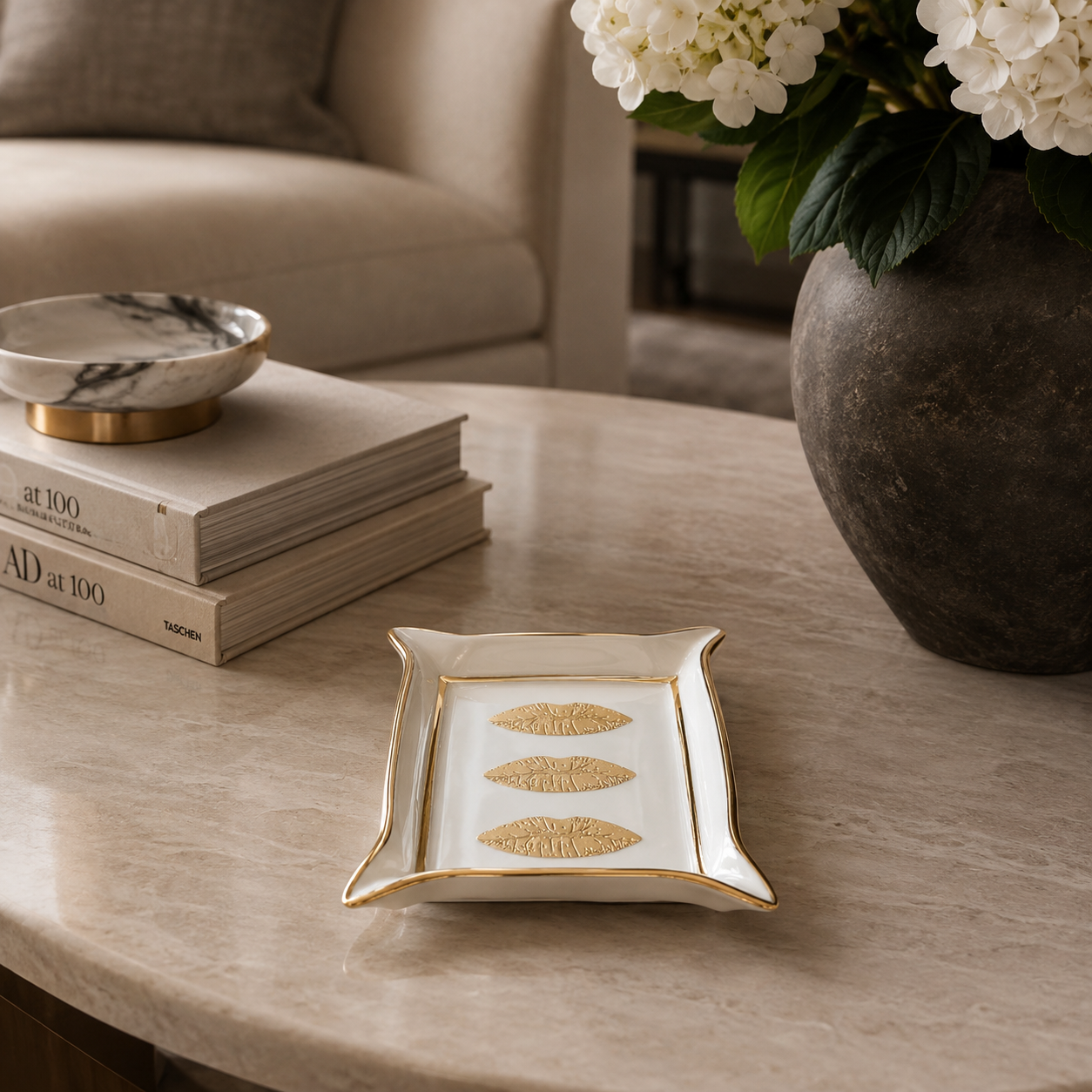 muse valet tray on coffee table next to other decor in a living room
