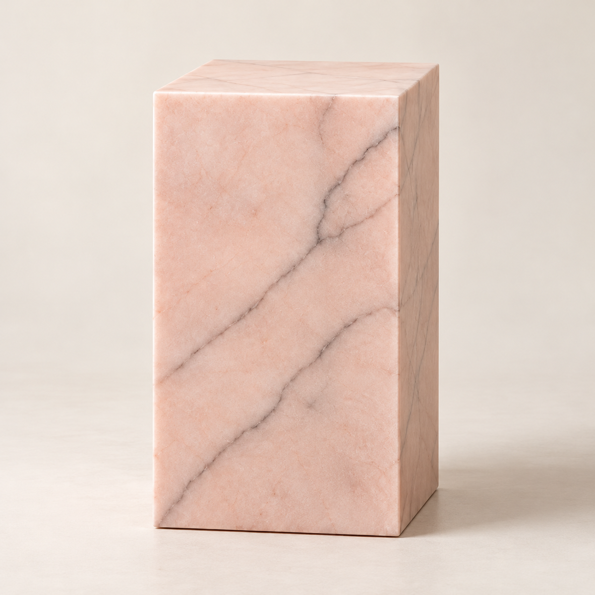 Pink onyx table with natural stone veining and square pedestal design