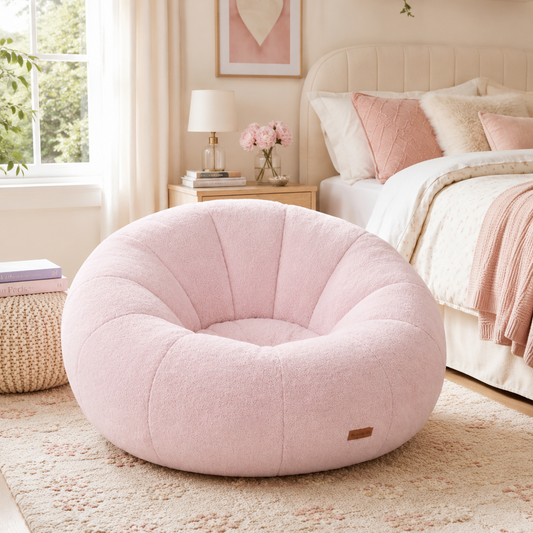 Pink Pumpkin Chair with plush rounded silhouette styled in a cozy bedroom with blush pink accents