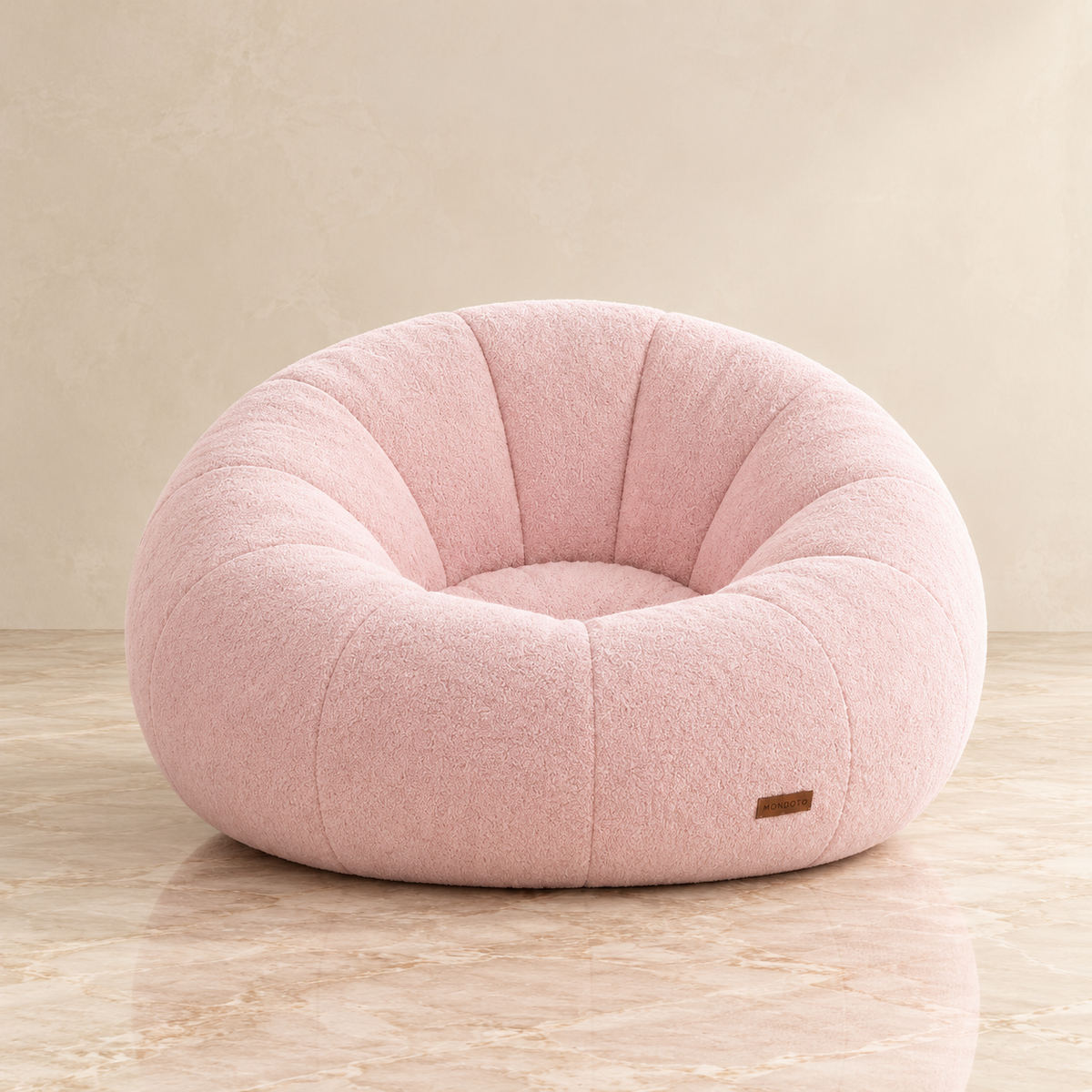 pink pumpkin chair in a studio image
