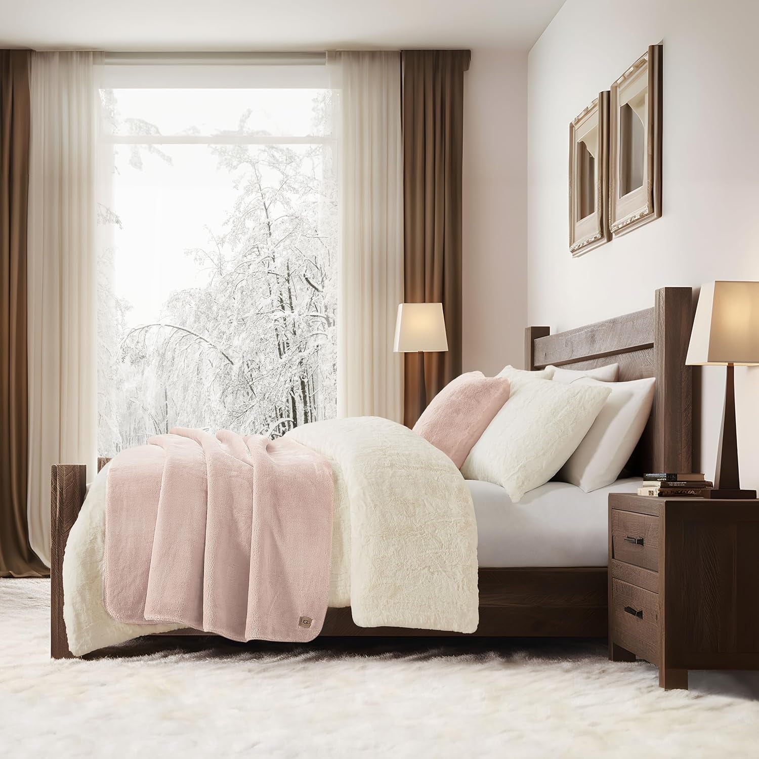 pink throw blanket in bedroom across the bed which is near to a window and a nighstand