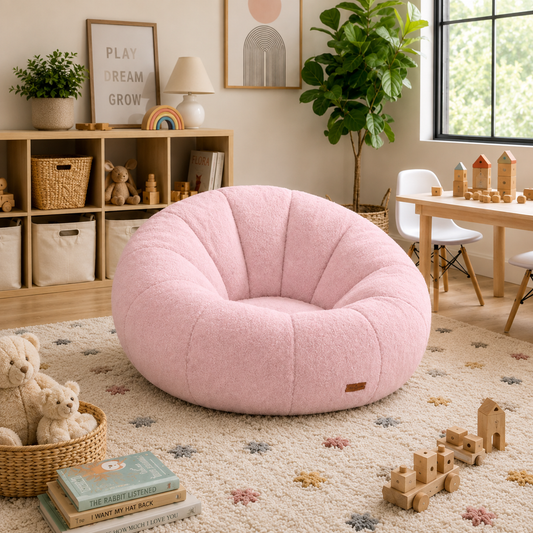 pumpkin chair in the middle of the floor of a playroom with toys around it