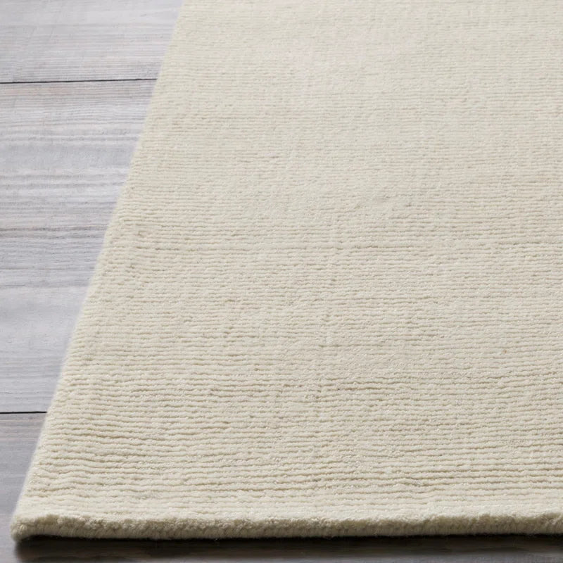 wool runner rug close up on hardwood floor