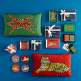 Load image into Gallery viewer, safari coaster as part of the collection on a blue background
