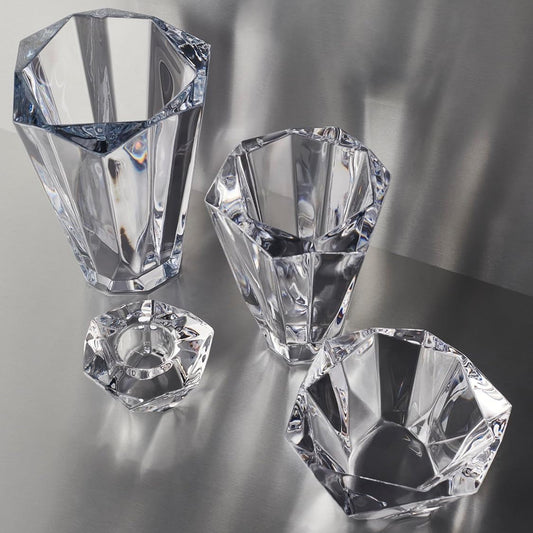 Shannon crystal vase set with geometric shapes on a reflective surface