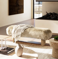 Load image into Gallery viewer, sheepskin bench in room with blanket tossed on it and it is across from a taple
