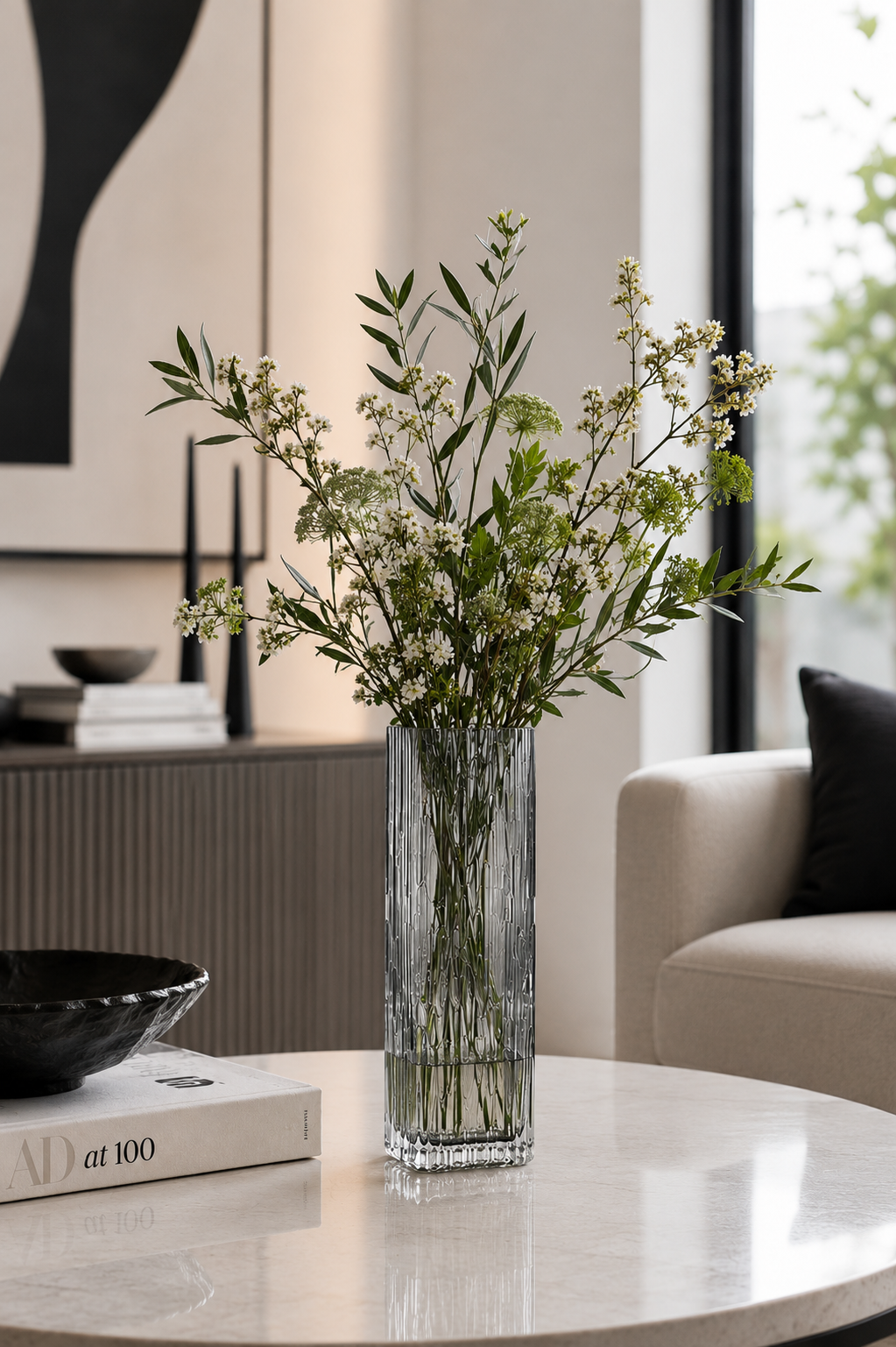Smoked Crystal Vase on table with stems and leaves in it