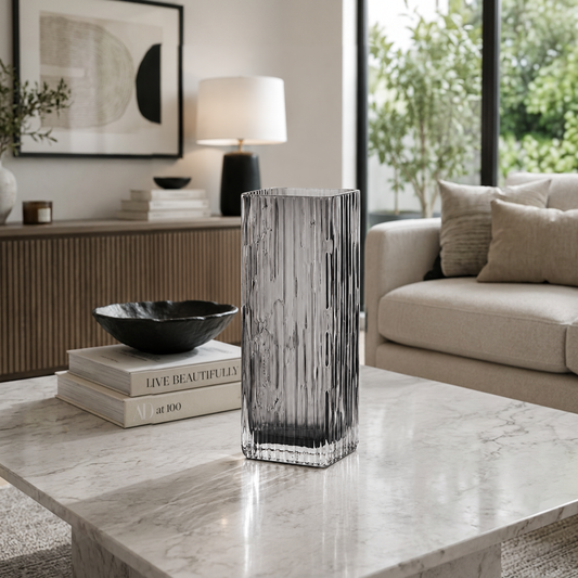 Smoked Crystal Vase in living room on table by coffee table books across from sofa